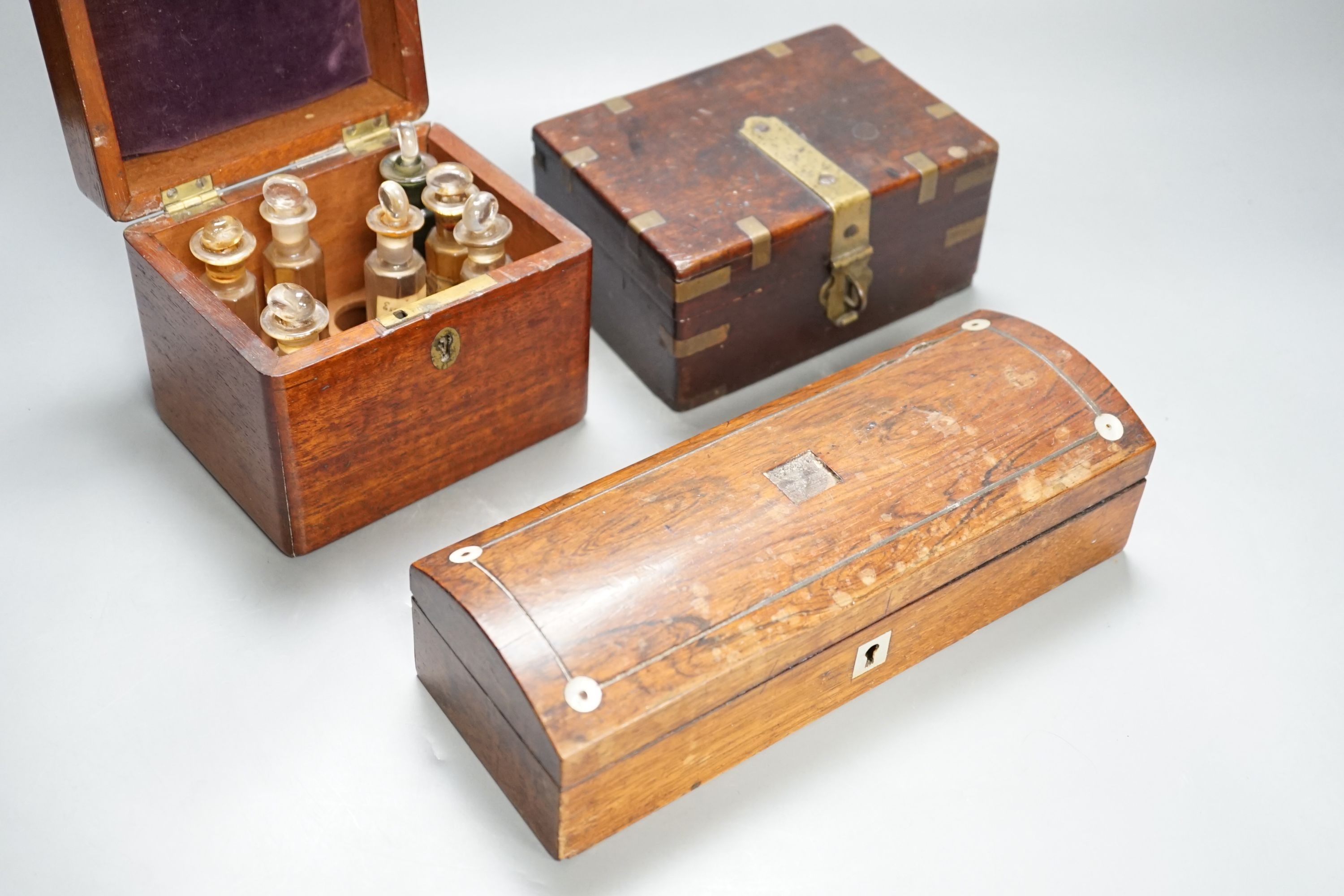 A Victorian mahogany medicine case, with bottles, 13cm. wide, a brass-mounted box and a rosewood veneered pen box